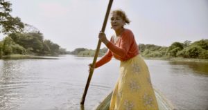 Martha Vega Hernandez sings while rowing a boat in Veracruz, Mexico